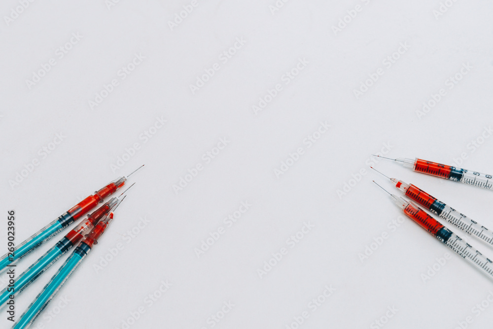 Fototapeta premium Treatment against addiction. Syringe with blood. Immunodeficiency.