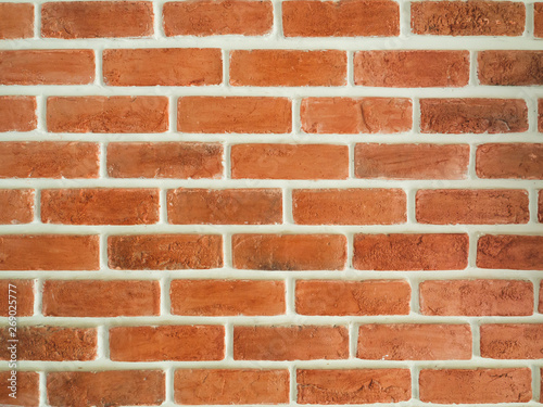 Brown brick wall with white cutting lines