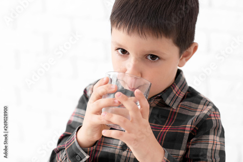 Little boy drinking fresh w...