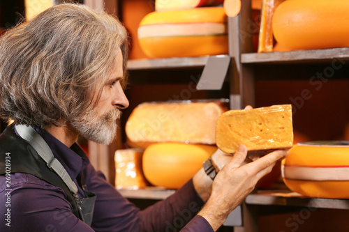 Business owner with cheese ...