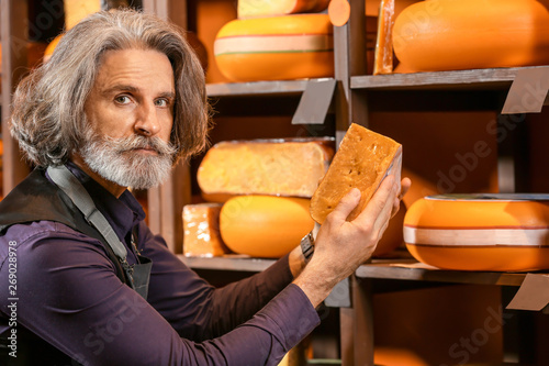 Business owner with cheese ...