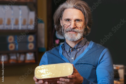 Business owner with cheese ...