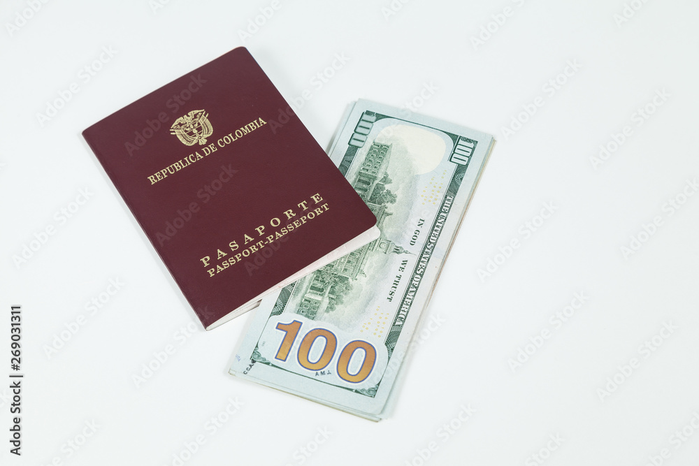 travel concept, Colombian passport with dollar bills for travel abroad travel concept, Colombian passport with dollar bills for travel abroad