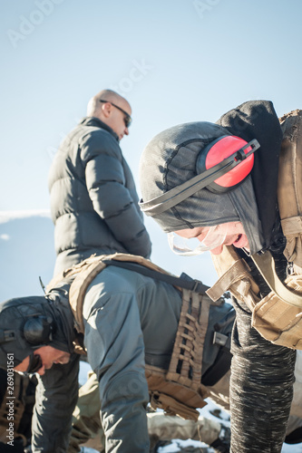 Instructor and army soldiers have hard training and doing push-ups