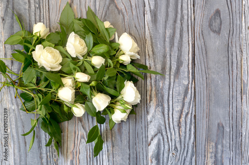 Roses on a wooden background