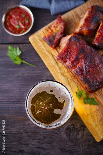 Beer and pork spare ribs. Ale and meat. Beer and food concept - Image