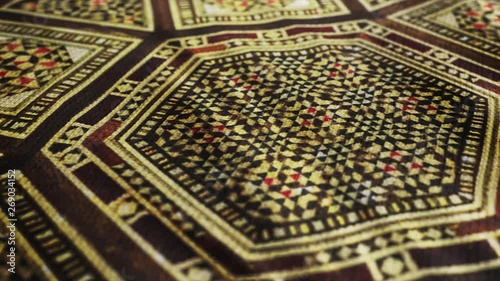 Fabric cloth with Traditional Islamic, Asian pattern is waving. Ottoman's design, vintage Oriental tablecloth. 