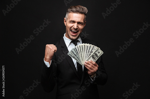 Confident attractive businessman wearing suit