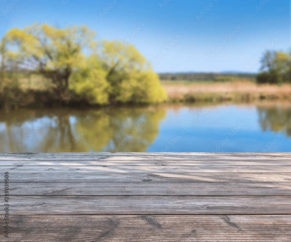 spring background with wooden terrace, blurred soft light with see and trees. product display template / presentation. Mock up template for display. spring background with wooden terrace, blurred soft light with see and trees. product display template / presentation. Mock up template for display.