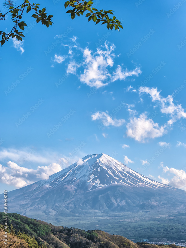 Close up top of beautiful Fuji mountain with snow cover on the top with clouds, Japan