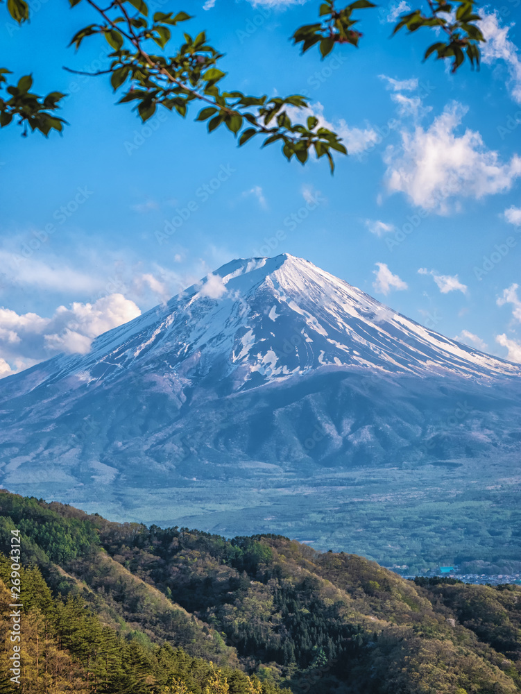 Close up top of beautiful Fuji mountain with snow cover on the top with clouds, Japan Close up top of beautiful Fuji mountain with snow cover on the top with clouds, Japan