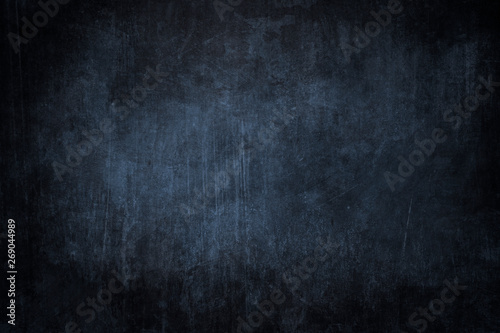 Dark blue grungy background or texture