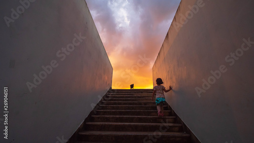 Children are walking up the stairs  at sky sunset © thexfilephoto