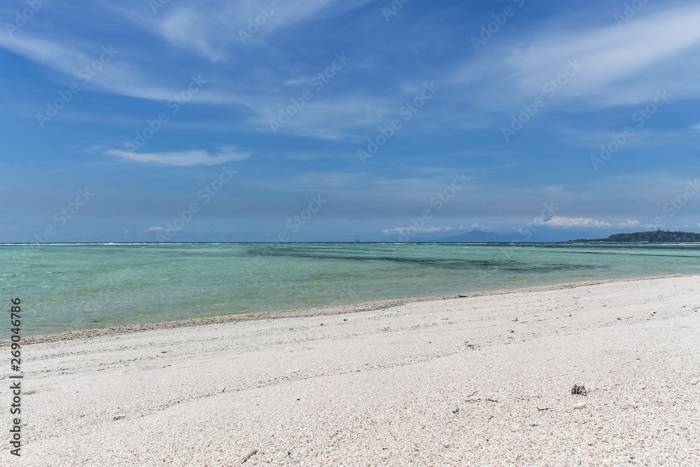 GILI AIR, INDONESIA - December 01, 2013: Pristine Waters and a white Sandy Beach on Gili Air. One of the three popular Gili Islands near Lombok, Indoniesia.