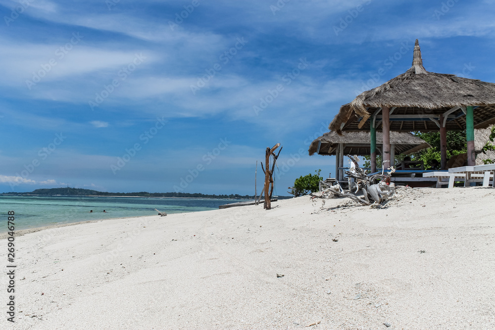 GILI AIR, INDONESIA - December 01, 2013: Pristine Waters and a white Sandy Beach on Gili Air. One of the three popular Gili Islands near Lombok, Indoniesia. GILI AIR, INDONESIA - December 01, 2013: Pristine Waters and a white Sandy Beach on Gili Air. One of the three popular Gili Islands near Lombok, Indoniesia.