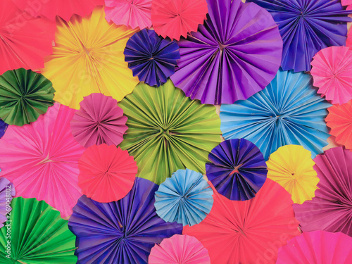 Colored paper cut into decorative circled the occasion texture. Abstract background