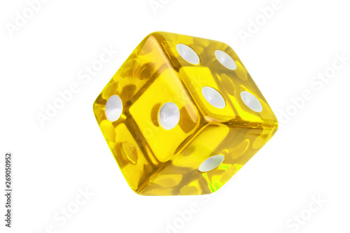 Yellow glass dice closeup isolated on white without shadow. One, two, four on the visible sides.