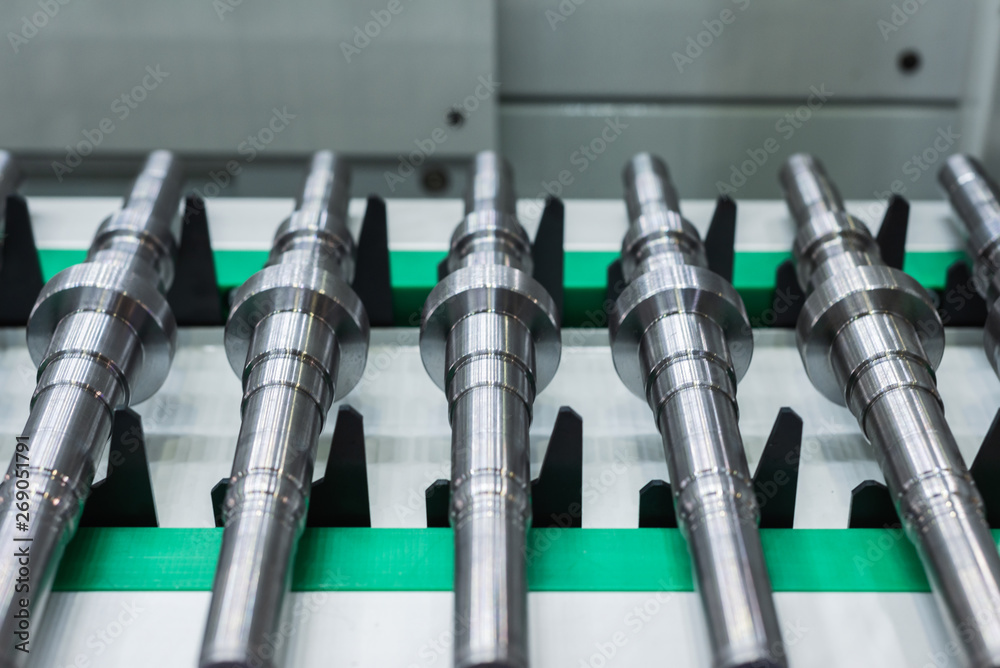 Metal shafts on the CNC conveyor transfer belt Metal shafts on the CNC conveyor transfer belt