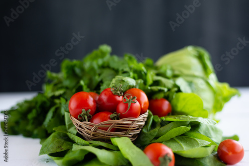 lots of fresh ingredients for making salad. Vegetables are on the table