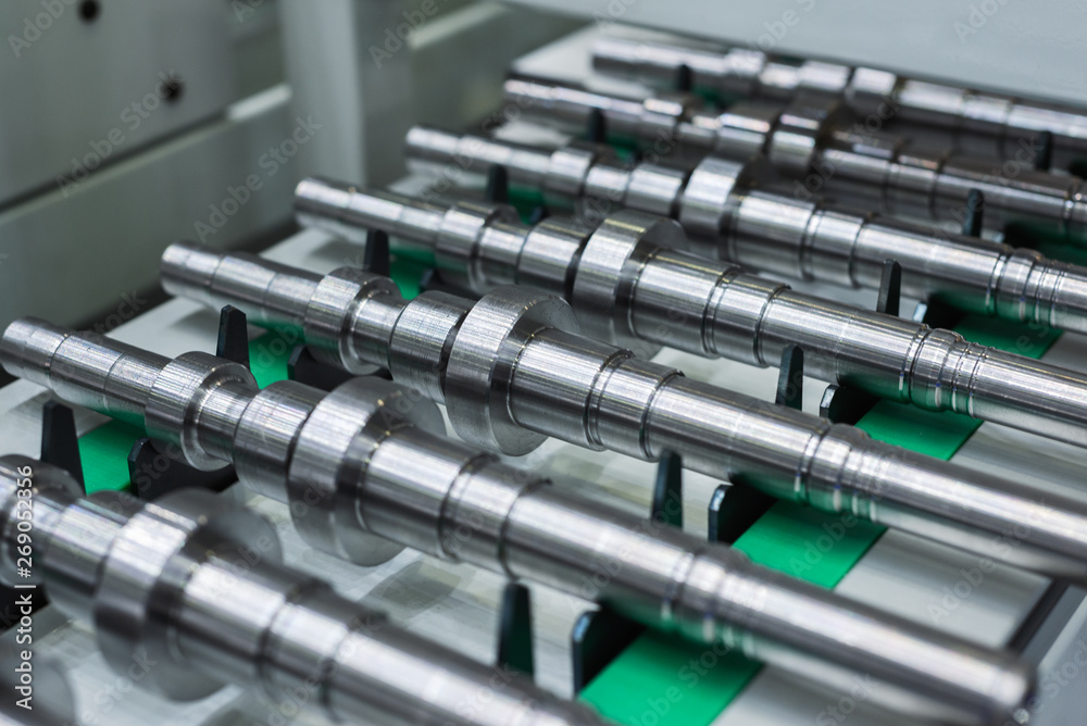 Metal shafts on the CNC conveyor transfer belt Metal shafts on the CNC conveyor transfer belt