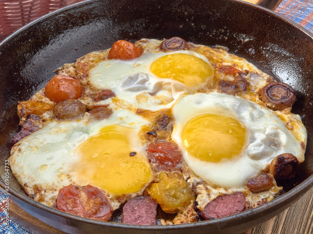 Breakfast. Fried eggs with mushrooms,tomatoes and sausage. Breakfast. Fried eggs with mushrooms,tomatoes and sausage.