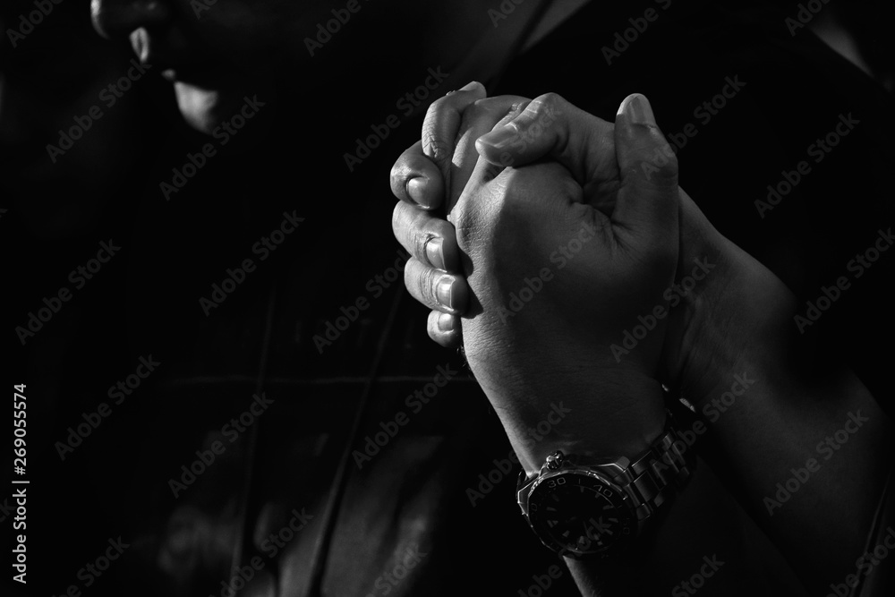 Man Friend Holding Hands and Praying Together. Vintage Style and Gain Added