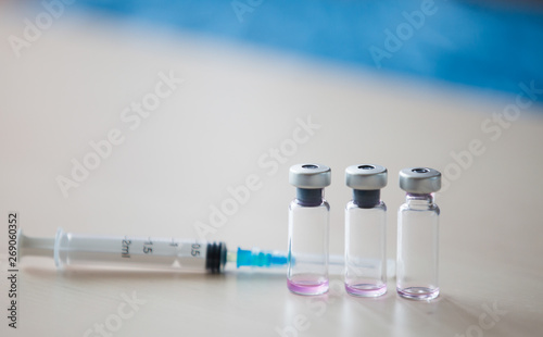 Vaccines bottles medical background. Anti vax concept