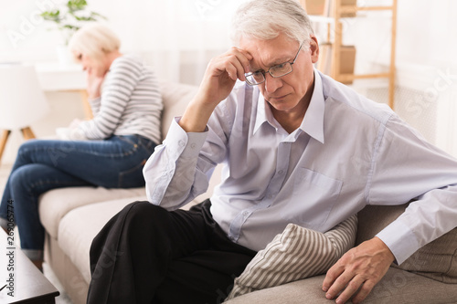 Relationship Problems. Senior Couple After Argument On Sofa