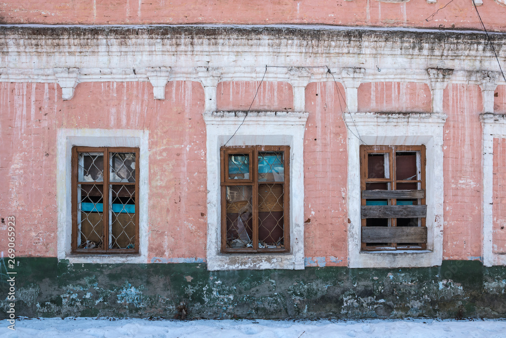 Old Windows with broken glass and broken frames in the old house.