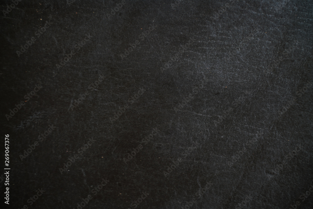 Genuine black cowhide leather background Genuine black cowhide leather background