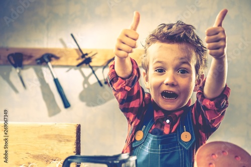 Child fathers day concept, carpenter tool,  kid little.