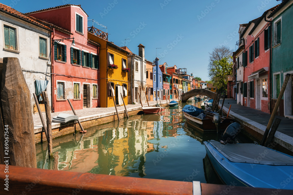 Colorful houses in Burano close to canal, Venice, Italy