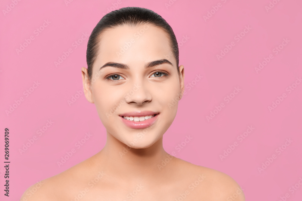 Portrait of young woman with beautiful face and natural makeup on color background Portrait of young woman with beautiful face and natural makeup on color background