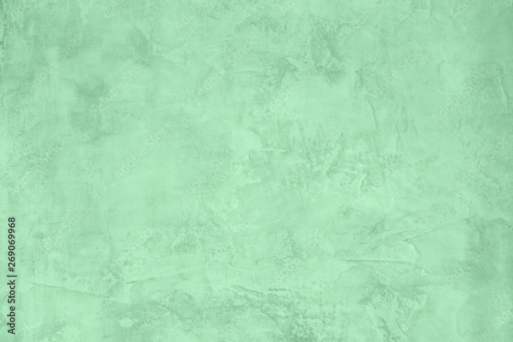Trendy Neo mint colored low contrast Rough Concrete textured background to your concept or product. Color of the year 2020