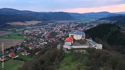 Aerial view of northeastern side of castle Slovenska Lupca and town of the same name under castle hill. Location Banska Bystrica district, central Slovakia. photo