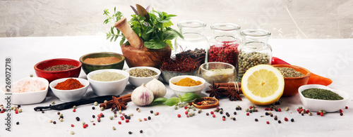 Spices and herbs on table. ...