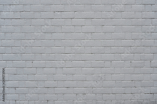 Abstract weathered textured white brick wall background