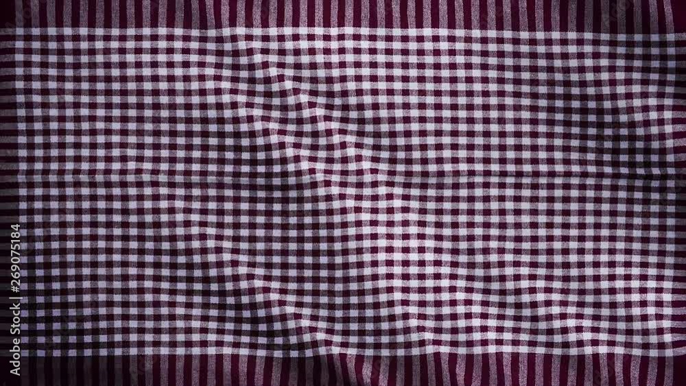 Burgundy white tablecloth, picnic gingham is waving. Top view checkered claret red fabric cloth background.