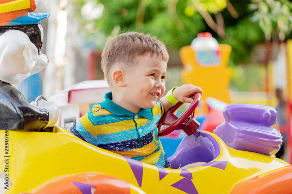 Child riding toy car. Little boy playing with big bus. Kid driving ...