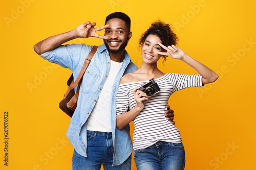 Happy Afro Couple Ready For Trip, Yellow Background