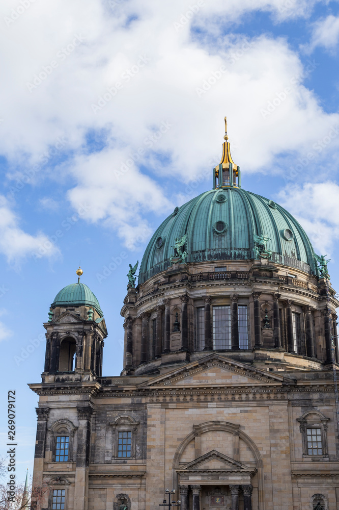 Upper part including the dome of the Berliner Dom (Berlin Cathedral), a historic landmark, in Berlin, Germany, on a sunny day.