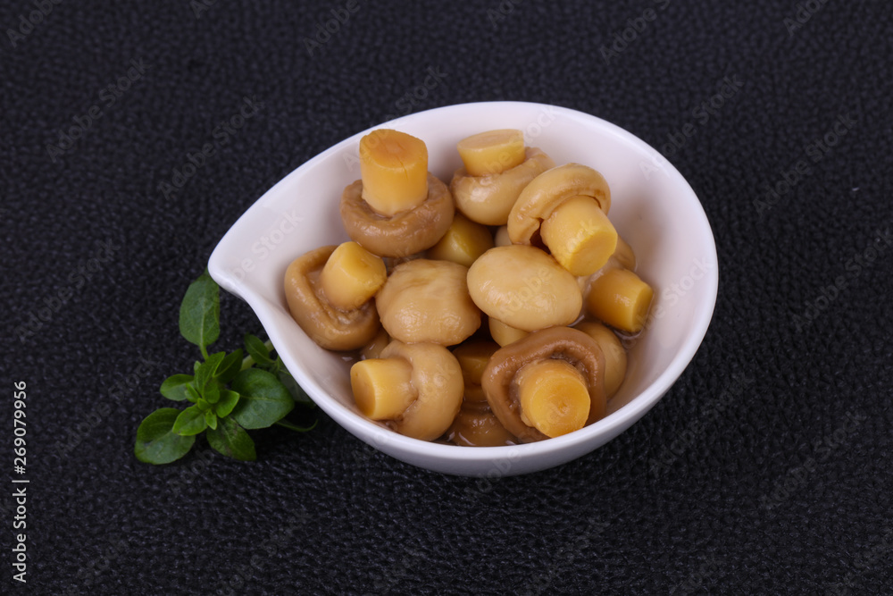 Pickled champignon heap in the bowl Pickled champignon heap in the bowl