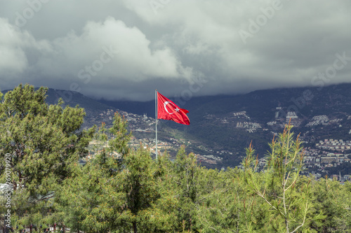 Flag of Turkey against the backdrop of mountains