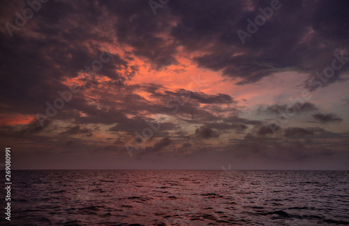 Picturesque sunset with lively colourful clouds