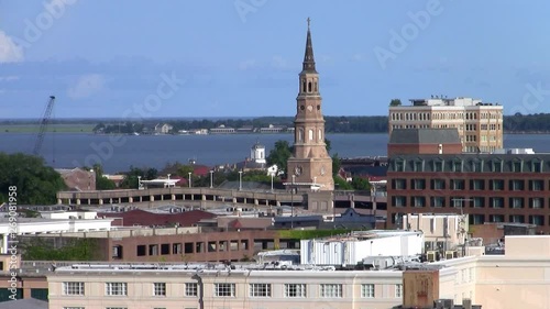 Cityscape of Charleston, South Carolina with the Spire of St. Phillips Episcopal Church, Aerial View with the Sea in the Background photo