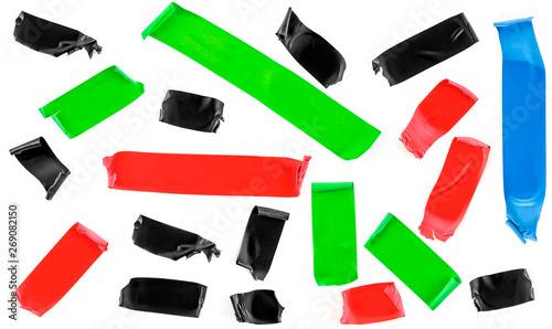Set of colored tape slices isolated on white background. Insulating tape of different shapes and colors.