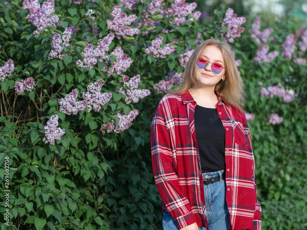 Blonde in sunglasses and shirt on lilac background with copyspace. Stylish youth Blonde in sunglasses and shirt on lilac background with copyspace. Stylish youth