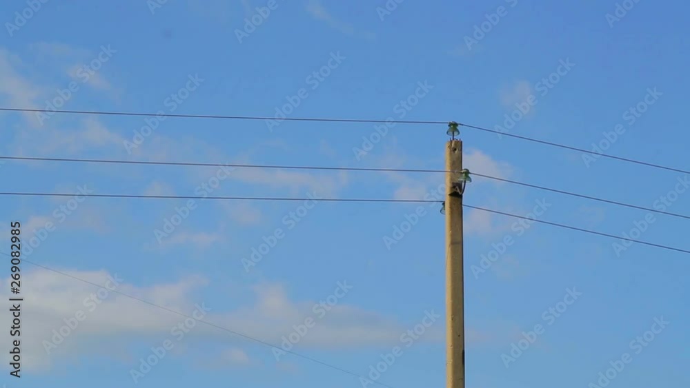 Power lines against the sky with clouds. Time laps Power lines against the sky with clouds. Time laps