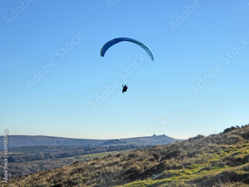 Paraglider flying above Dartmoor
