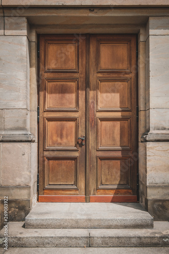 Old wooden door isolated on historic building  -